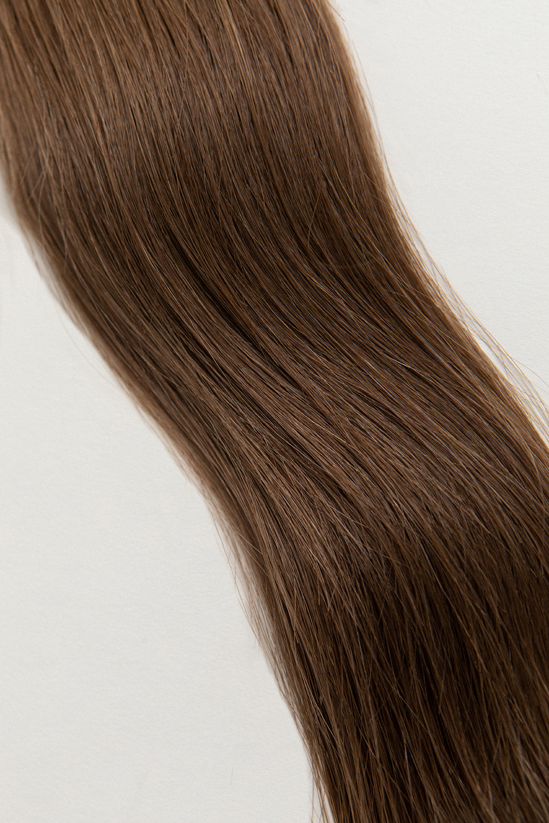 Walnut is our light brown, with cool yet rich undertones. Stylist lingo: Natural level 7 Hidden Harloc Clip-In Extensions are made from ethically sourced, Remy Slavic hair. They come with 5 seamless silicone wefts to ensure an undetectable result that is comfortable to wear. Whether you are looking to add volume or length, a stunning look for a special event, or just want to look and feel gorgeous. Available in 10 of our beautiful shades.