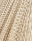Moonstone is our lightest and brightest blonde with slight golden undertones. C'mon Barbie, let's go party! Stylist lingo: Natural level 10 Harloc Tape-In Extensions are made from ethically sourced, premium, Remy Slavic Hair. These reusable hair extensions can be used to add length, volume, chemical-free colour, or to correct or enhance a haircut. Available in 16 beautiful shades. Combine multiple colours to create a custom colour blend and perfect match.