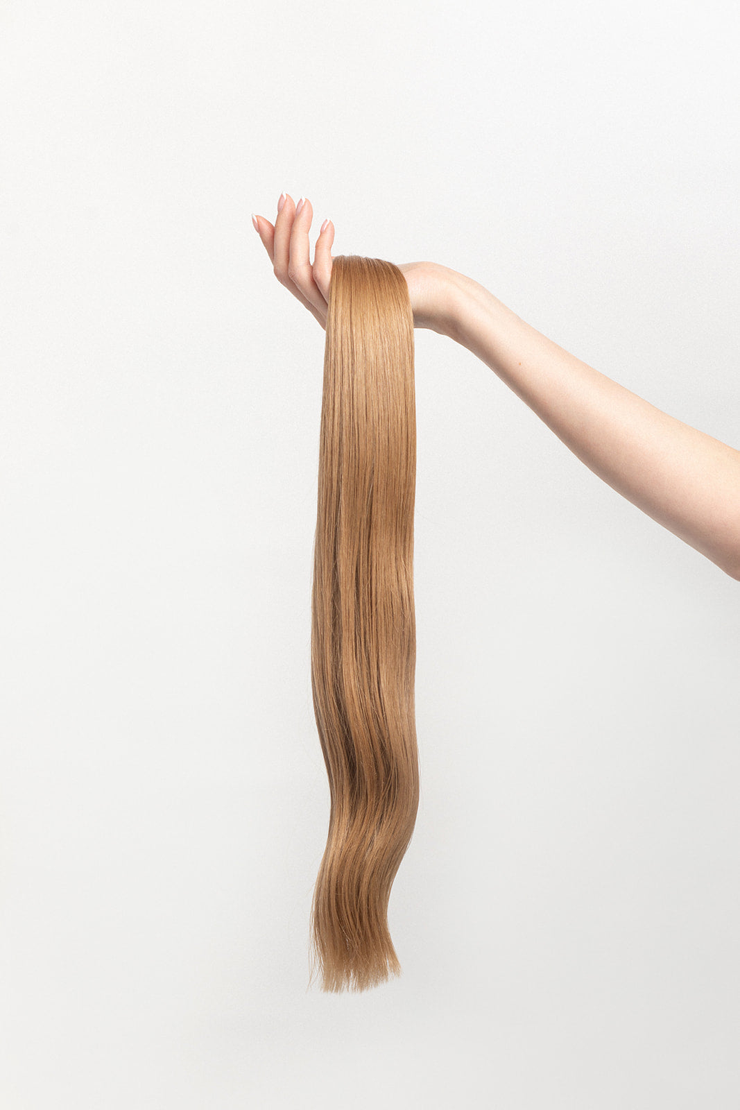 Sand is our darkest blonde with cool reflections. Wear it on its own or to perfectly compliment any highlight. Stylist lingo: Natural/beige level 8  Harloc Tape-In Extensions are made from ethically sourced, premium, Remy Slavic Hair. These reusable hair extensions can be used to add length, volume, chemical-free colour, or to correct or enhance a haircut. Available in 16 beautiful shades. Combine multiple colours to create a custom colour blend and perfect match.