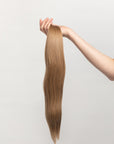 Smoked Topaz is our rooted, neutral brunette blend. Stylist lingo: Natural rooted level 6 blended into a natural/beige level 8 Harloc Tape-In Extensions are made from ethically sourced, premium, Remy Slavic Hair. These reusable hair extensions can be used to add length, volume, chemical-free colour, or to correct or enhance a haircut. Available in 16 beautiful shades. Combine multiple colours to create a custom colour blend and perfect match.