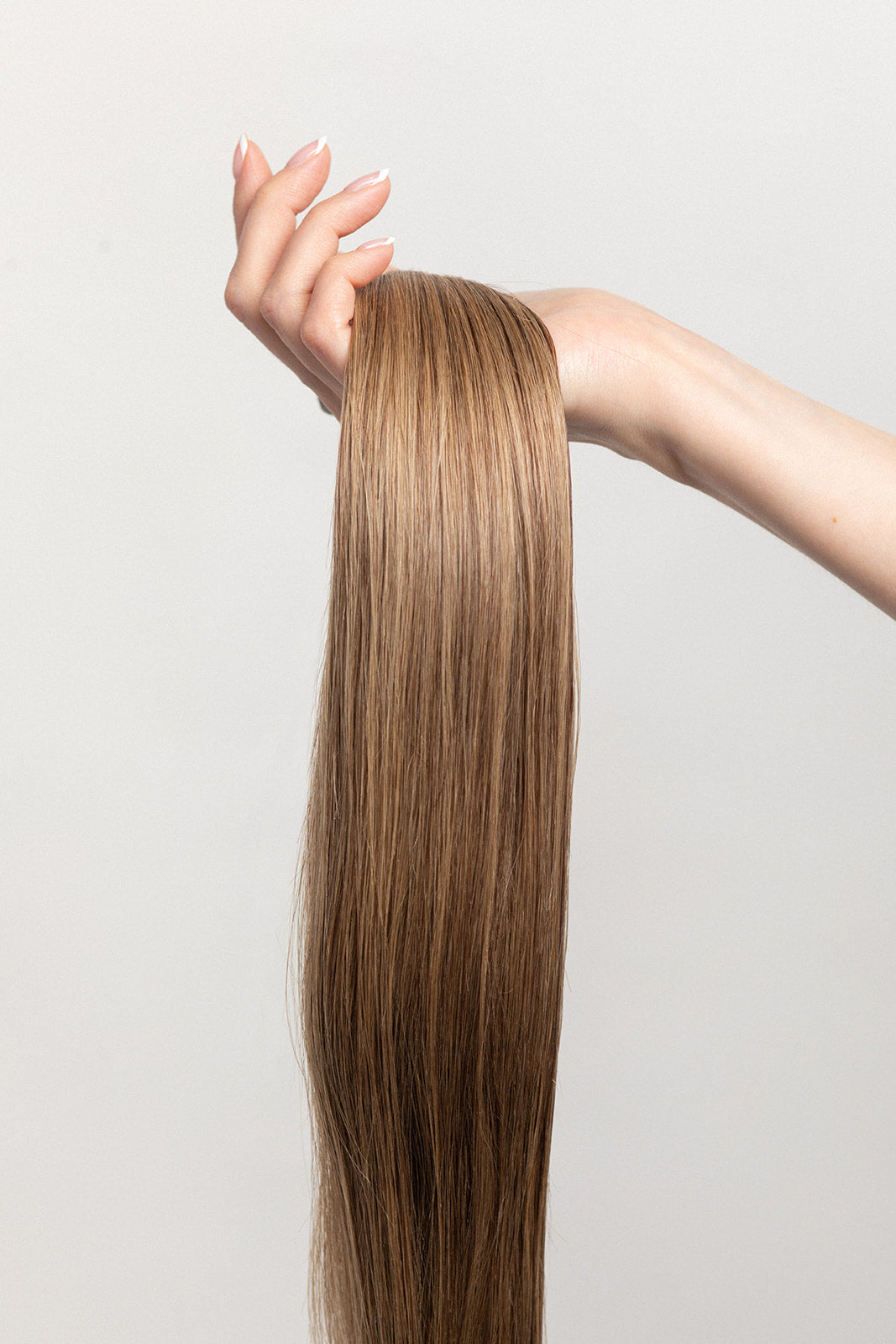 Spiced Suede is our flawless balayage brunette blend. Stylist lingo: Natural rooted level 6 blended into natural/gold dimensional levels 6 & 9 Hidden Harloc Clip-In Extensions are made from ethically sourced, Remy Slavic hair. They come with 5 seamless silicone wefts to ensure an undetectable result that is comfortable to wear. Whether you are looking to add volume or length, a stunning look for a special event, or just want to look and feel gorgeous. Available in 10 of our beautiful shades.