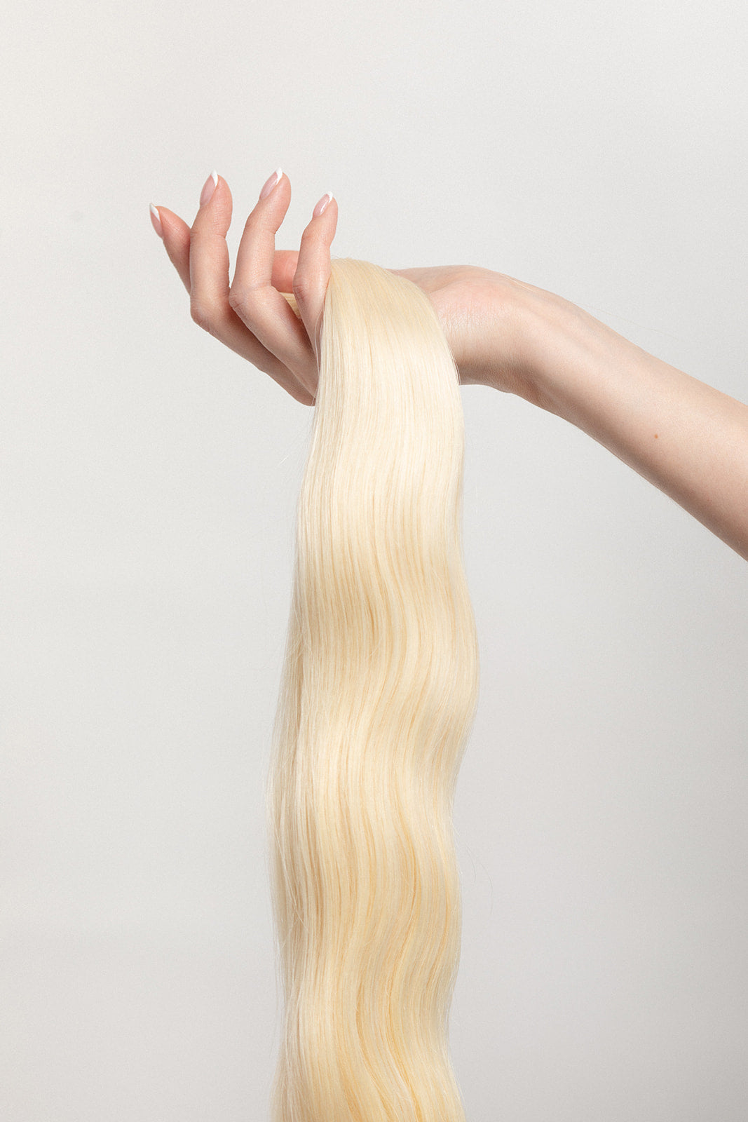 Porcelain is one of our brightest blondes with neutral undertones. If you  discover dragons on your doorstep...we warned you! #motherofdragons  Stylist lingo: Natural/beige level 10 Harloc Tape-In Extensions are made from ethically sourced, premium, Remy Slavic Hair. These reusable hair extensions can be used to add length, volume, chemical-free colour, or to correct or enhance a haircut. Available in 16 beautiful shades. Combine multiple colours to create a custom colour blend and perfect match.
