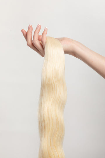 Porcelain is one of our brightest blondes with neutral undertones. If you  discover dragons on your doorstep...we warned you! #motherofdragons  Stylist lingo: Natural/beige level 10 Harloc Tape-In Extensions are made from ethically sourced, premium, Remy Slavic Hair. These reusable hair extensions can be used to add length, volume, chemical-free colour, or to correct or enhance a haircut. Available in 16 beautiful shades. Combine multiple colours to create a custom colour blend and perfect match.