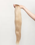 Soleil Sand is our golden blonde blend cascading from a Sand root.Stylist lingo: Natural rooted level 8 blended into natural/gold dimensional levels 8 & 10 Harloc Tape-In Extensions are made from ethically sourced, premium, Remy Slavic Hair. These reusable hair extensions can be used to add length, volume, chemical-free colour, or to correct or enhance a haircut. Available in 16 beautiful shades. Combine multiple colours to create a custom colour blend and perfect match.