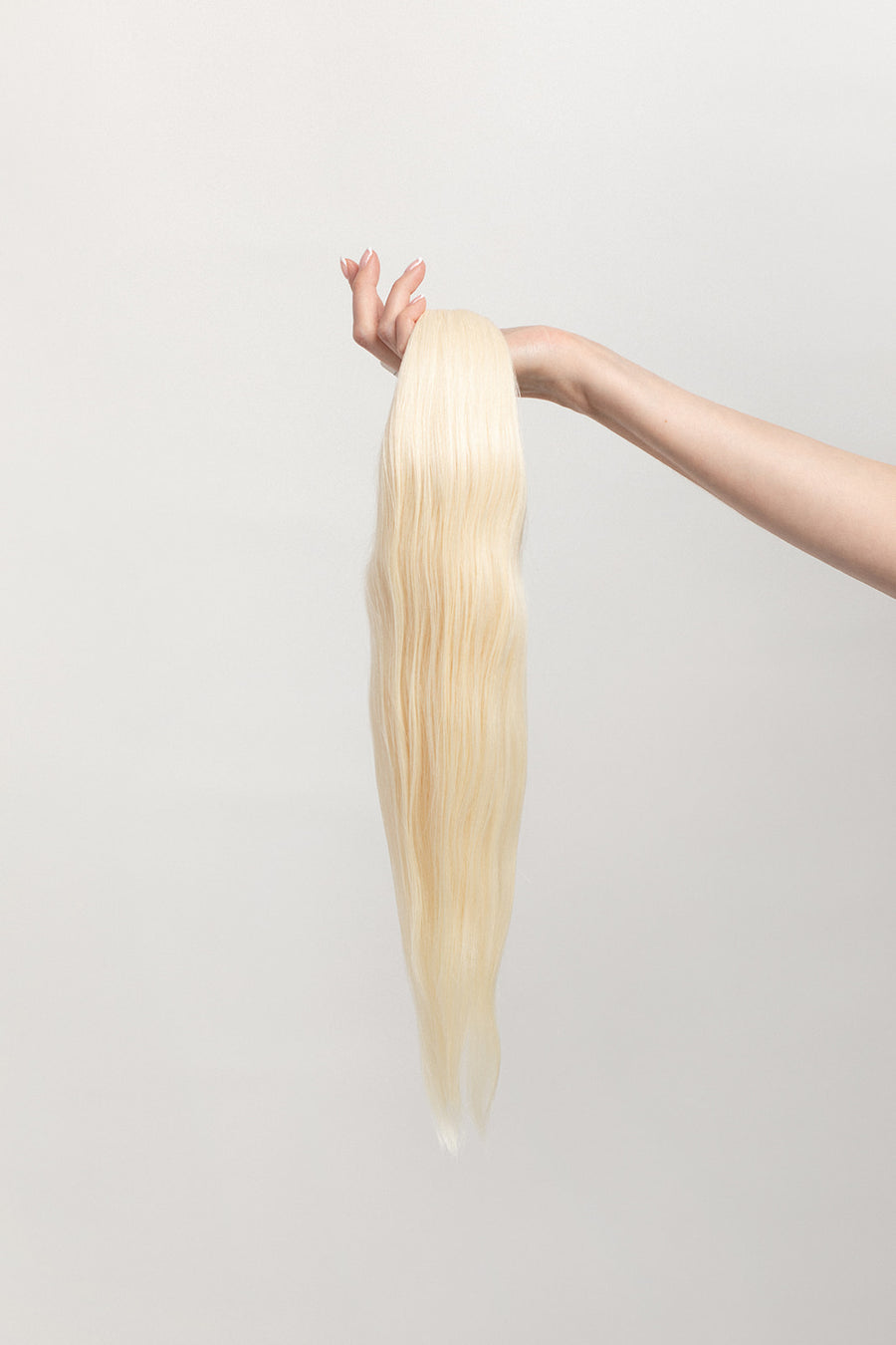 Moonstone is our lightest and brightest blonde with slight golden undertones. C'mon Barbie, let's go party! Stylist lingo: Natural level 10 Harloc Tape-In Extensions are made from ethically sourced, premium, Remy Slavic Hair. These reusable hair extensions can be used to add length, volume, chemical-free colour, or to correct or enhance a haircut. Available in 16 beautiful shades. Combine multiple colours to create a custom colour blend and perfect match.