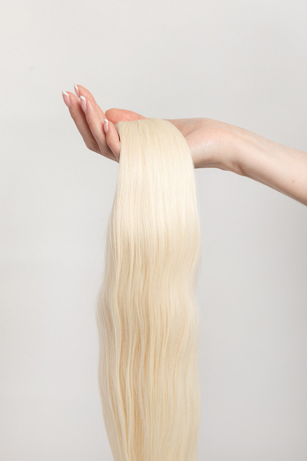 Moonstone is our lightest and brightest blonde with slight golden undertones. C'mon Barbie, let's go party! Stylist lingo: Natural level 10 Harloc Tape-In Extensions are made from ethically sourced, premium, Remy Slavic Hair. These reusable hair extensions can be used to add length, volume, chemical-free colour, or to correct or enhance a haircut. Available in 16 beautiful shades. Combine multiple colours to create a custom colour blend and perfect match.