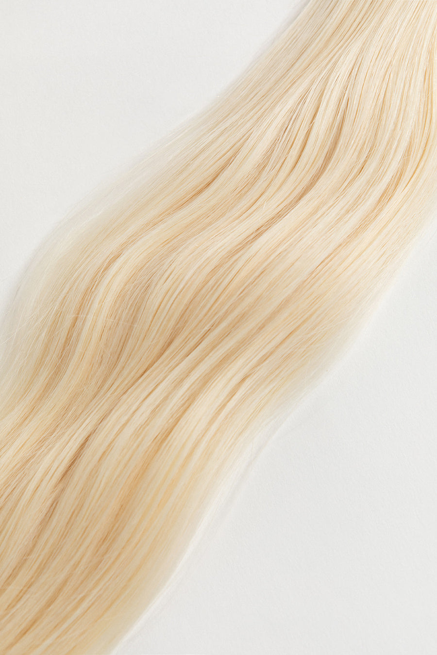 Moonstone is our lightest and brightest blonde with slight golden undertones. C'mon Barbie, let's go party! Stylist lingo: Natural level 10 Harloc Tape-In Extensions are made from ethically sourced, premium, Remy Slavic Hair. These reusable hair extensions can be used to add length, volume, chemical-free colour, or to correct or enhance a haircut. Available in 16 beautiful shades. Combine multiple colours to create a custom colour blend and perfect match.