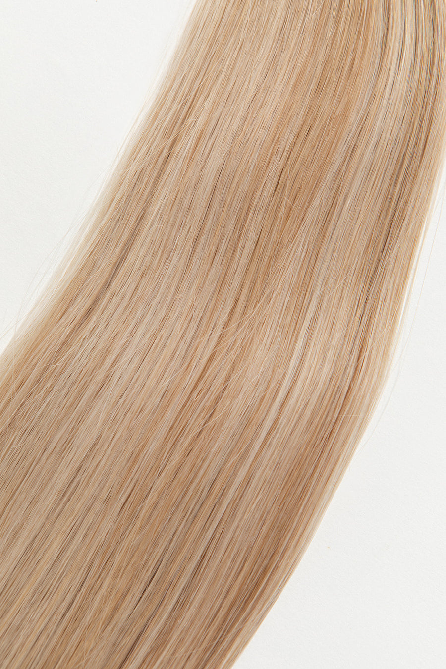 Honey is our dimensional blonde with warm undertones. This will have you feeling sweet like honey but stinging like a bee. Stylist lingo: Natural/gold dimensional mix of levels 9 & 10 Harloc Tape-In Extensions are made from ethically sourced, premium, Remy Slavic Hair. These reusable hair extensions can be used to add length, volume, chemical-free colour, or to correct or enhance a haircut. Available in 16 beautiful shades. Combine multiple colours to create a custom colour blend and perfect match.