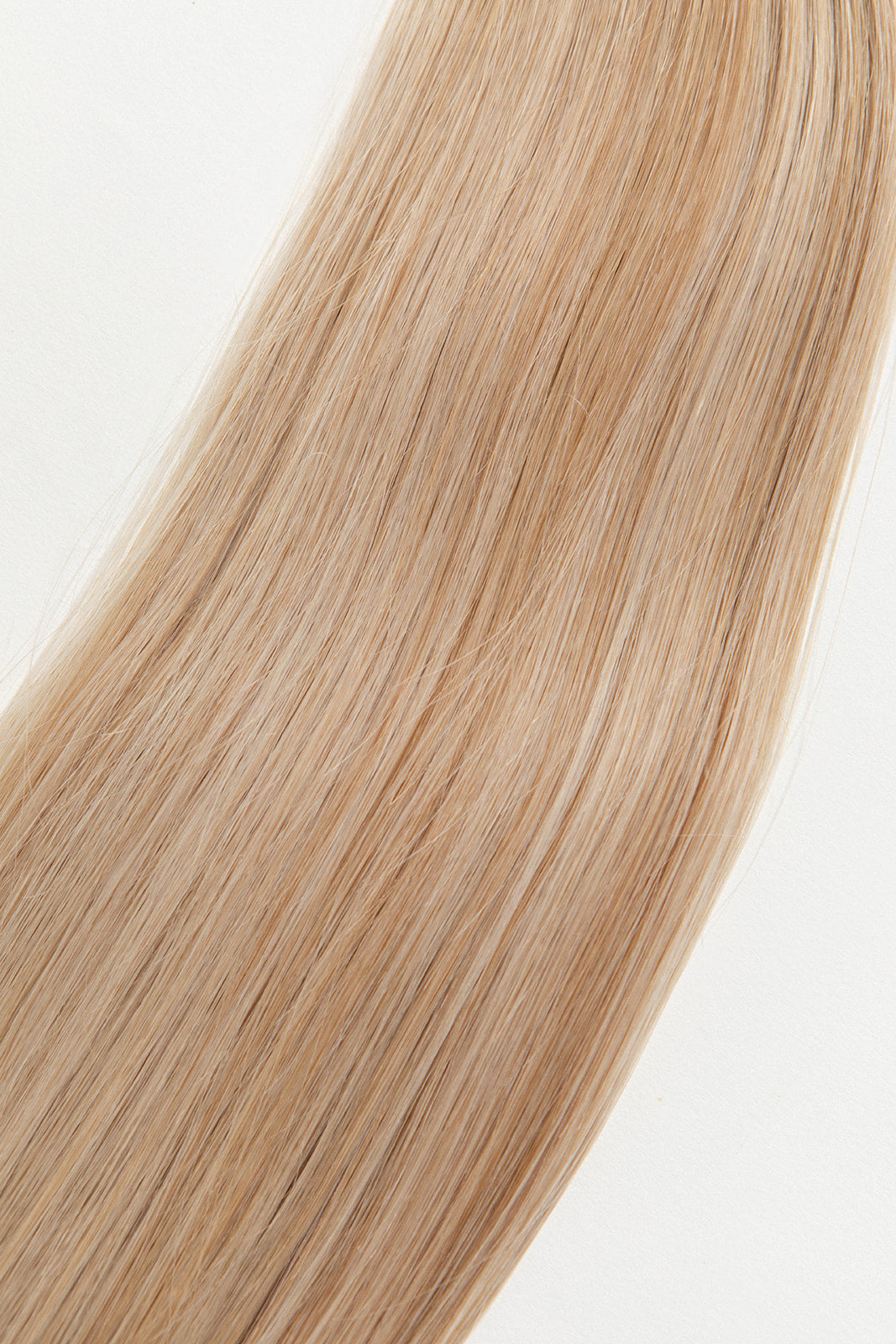 Honey is our dimensional blonde with warm undertones.  Hidden Harloc Clip-In Extensions are made from ethically sourced, Remy Slavic hair. They come with 5 seamless silicone wefts to ensure an undetectable result that is comfortable to wear. Whether you are looking to add volume or length, a stunning look for a special event, or just want to look and feel gorgeous. Available in 10 of our beautiful shades.