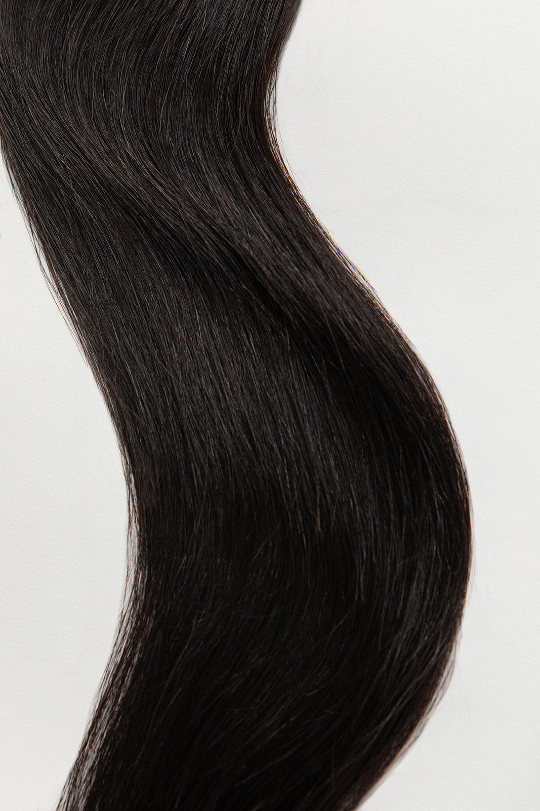 Nightfall is our darkest brown with cool undertones.  Stylist lingo: Natural level 3/4 Hidden Harloc Clip-In Extensions are made from ethically sourced, Remy Slavic hair. They come with 5 seamless silicone wefts to ensure an undetectable result that is comfortable to wear. Whether you are looking to add volume or length, a stunning look for a special event, or just want to look and feel gorgeous. Available in 10 of our beautiful shades.
