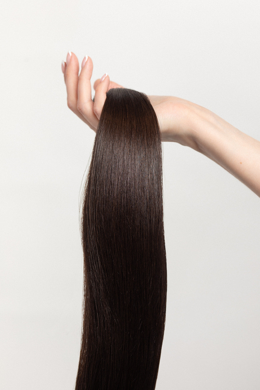 Shade is our dark brown with cool and warm undertones. Order it like you do your morning espresso: straight up, no dairy.  Stylist lingo: Natural level 5 Harloc Tape-In Extensions are made from ethically sourced, premium, Remy Slavic Hair. These reusable hair extensions can be used to add length, volume, chemical-free colour, or to correct or enhance a haircut. Available in 16 beautiful shades. Combine multiple colours to create a custom colour blend and perfect match.