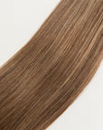 Spiced Suede is our flawless balayage brunette blend. Stylist lingo: Natural rooted level 6 blended into natural/gold dimensional levels 6 & 9The Harloc Ponytail Extension is our clip-in ponytail that is made from ethically sourced, Remy Slavic hair. It is a quick way to instantly add length and volume to your ponytail and it comes in two lengths, 18-20” and 20-24”. It comes with a velcro base and clip to secure the ponytail. Available in 10 of our beautiful shades.