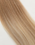 Soleil Sand is our golden blonde blend cascading from a Sand root.  Stylist lingo: Natural rooted level 8 blended into natural/gold dimensional levels 8 & 10 Hidden Harloc Clip-In Extensions are made from ethically sourced, Remy Slavic hair. They come with 5 seamless silicone wefts to ensure an undetectable result that is comfortable to wear. Whether you are looking to add volume or length, a stunning look for a special event, or just want to look and feel gorgeous. Available in 10 of our beautiful shades.