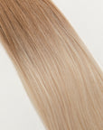 Vetiver Vanilla is our icy blonde, blended out from a Sand root.  Stylist lingo: Natural rooted level 8 blended into an icy level 10  Harloc Tape-In Extensions are made from ethically sourced, premium, Remy Slavic Hair. These reusable hair extensions can be used to add length, volume, chemical-free colour, or to correct or enhance a haircut. Available in 16 beautiful shades. Combine multiple colours to create a custom colour blend and perfect match.