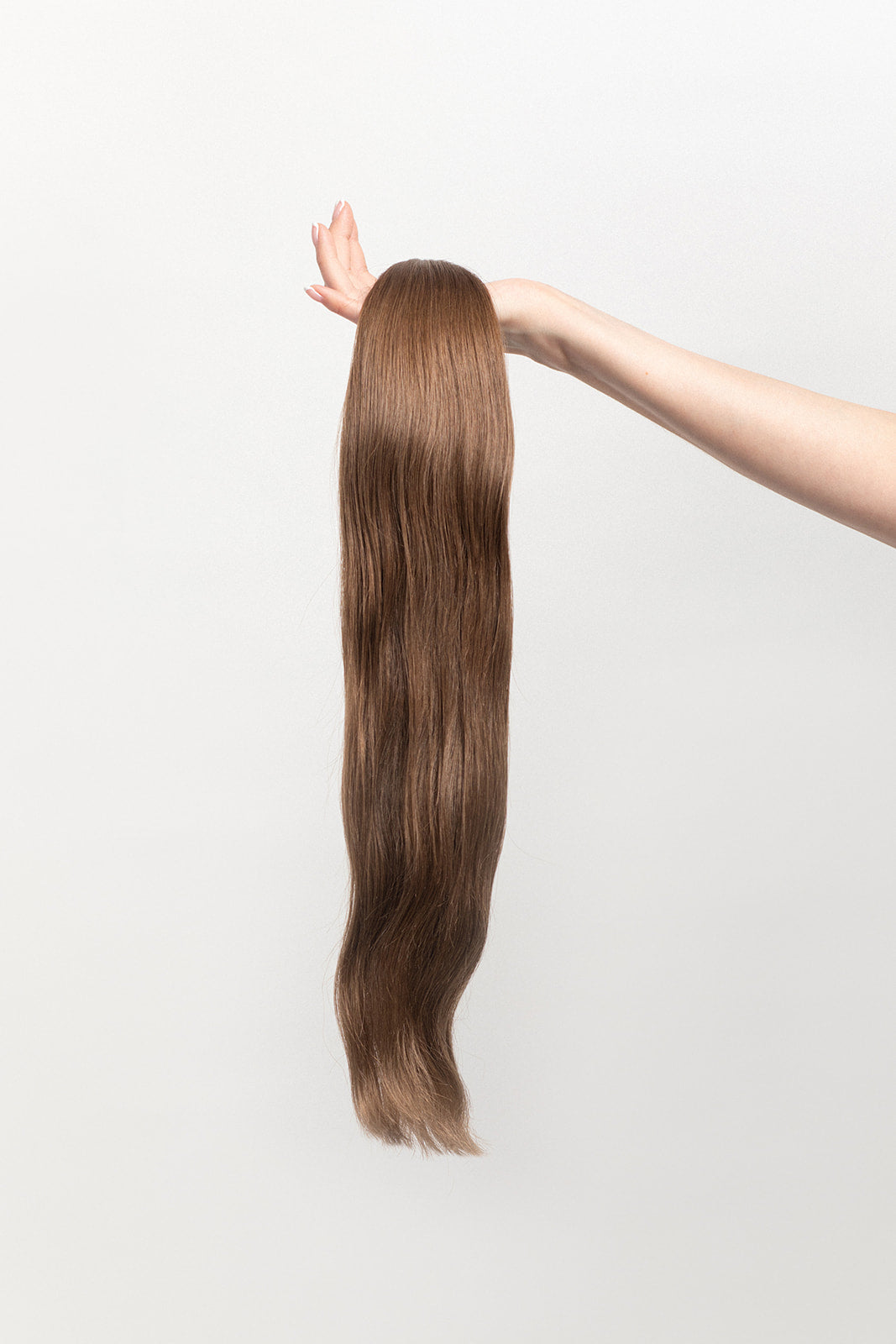Walnut is our light brown, with cool yet rich undertones. Stylist lingo: Natural level 7 The Harloc Ponytail Extension is our clip-in ponytail that is made from ethically sourced, Remy Slavic hair. It is a quick way to instantly add length and volume to your ponytail and it comes in two lengths, 18-20” and 20-24”. It comes with a velcro base and clip to secure the ponytail. Available in 10 of our beautiful shades.